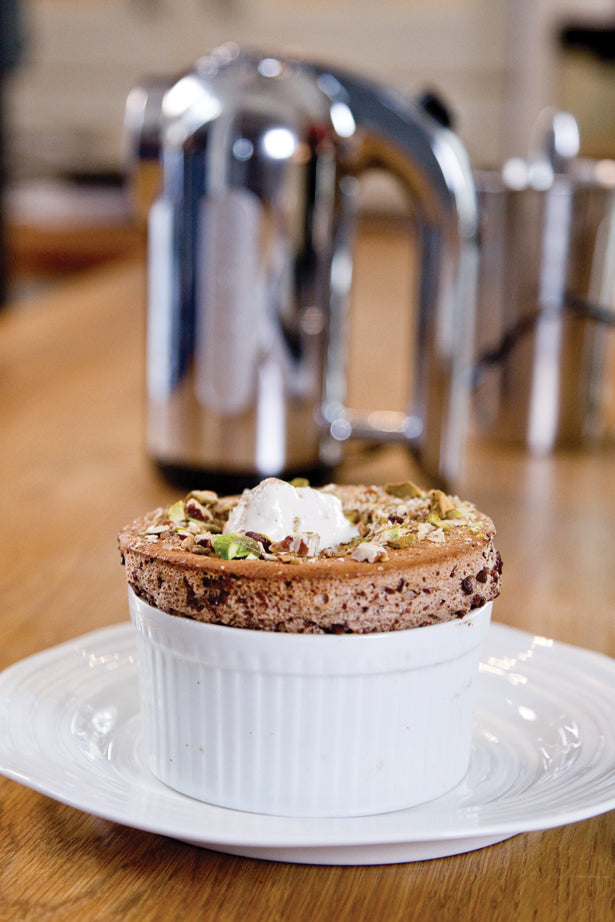 Chocolate soufflé with pistachio and pecan crumble created by Monica Galetti