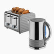 Telegrey coloured toaster with bread slices and a matching silver kettle on a white background_thumb_1