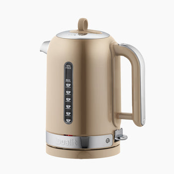 Beige 'sandstone' Dualit kettle with silver accents on a white background
