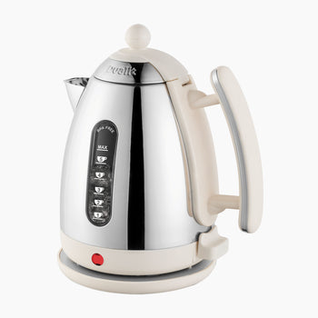 A Canvas white and black Dualit electric kettle with a stainless steel body and a Canvas white (cream) handle, featuring control buttons on the front.